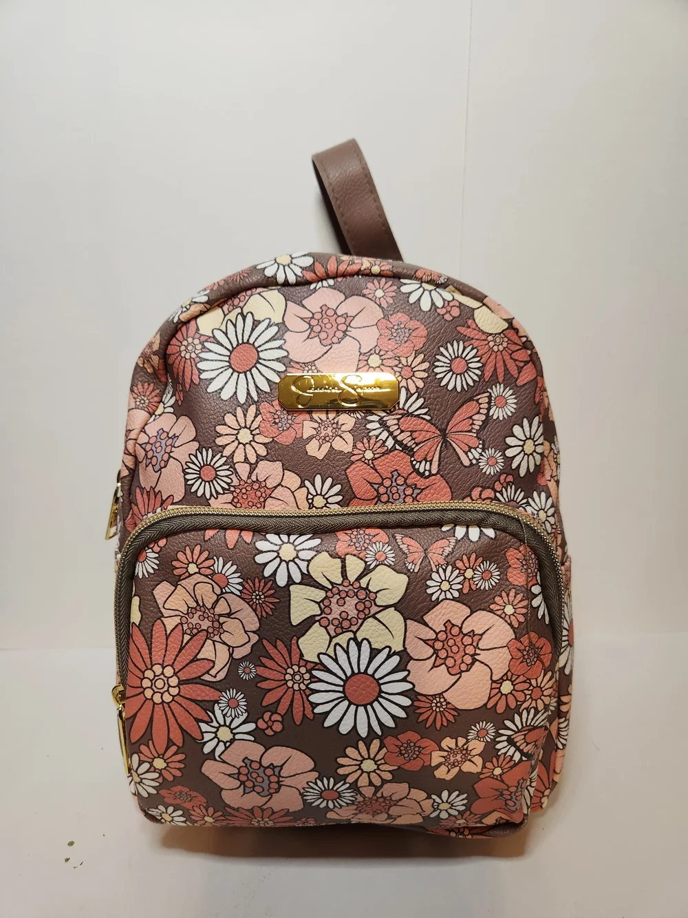 Jessica Simpson backpack with butterfly design.